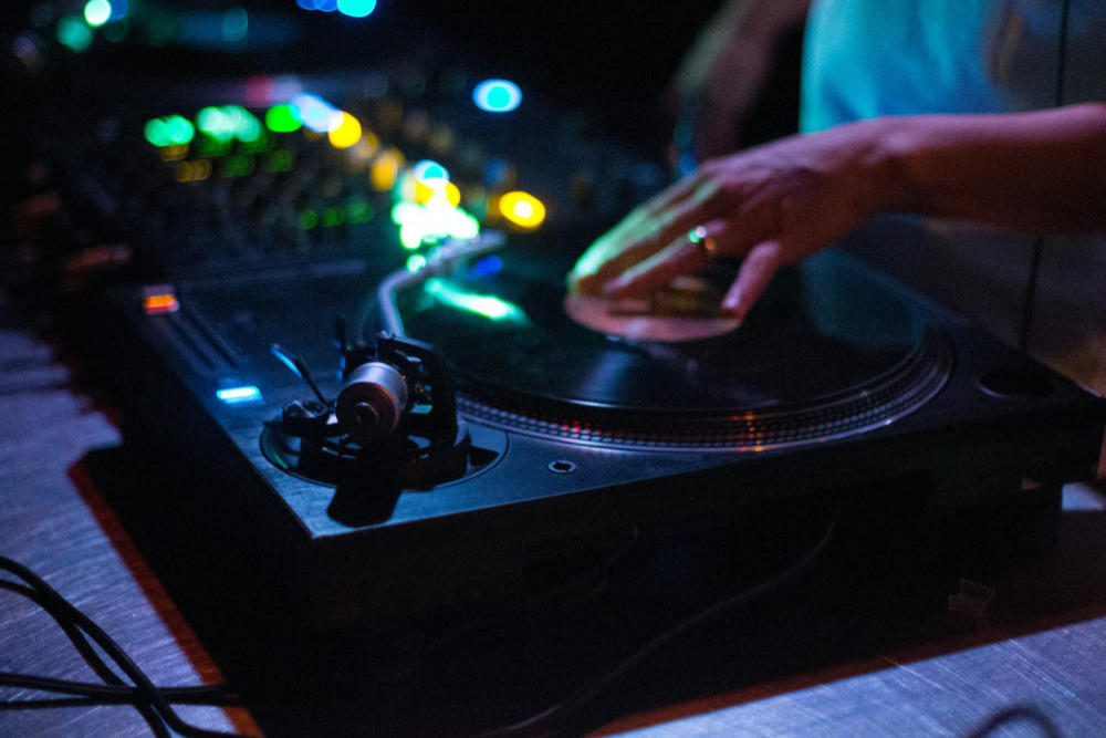 DJ Playing Techno Music with Vinyls